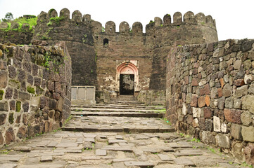 Daulatabad fort entrance in maharashtra india. Built with massive stone walls showcasing medieval military architecture and cultural heritage.It is now an  tourist attraction with historical building.
