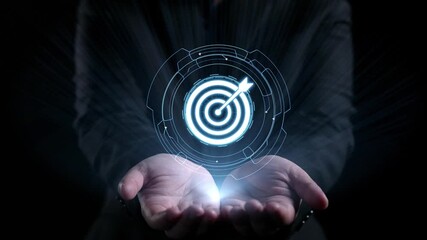A pair of hands holding a glowing interface representing marketing strategy, featuring a target symbol and various analytics elements, symbolizing digital business advancement. Qubit - Powered by Adobe