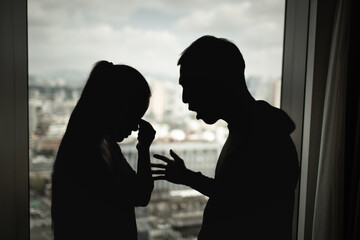Couple arguing indoors relationship conflict emotional stress and breakup concept