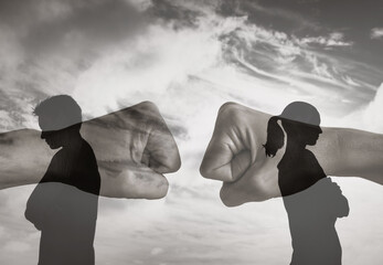 couple standing back to back with clenched fists in the background, symbolizing anger, relationship conflict, emotional tension, and unresolved arguments

