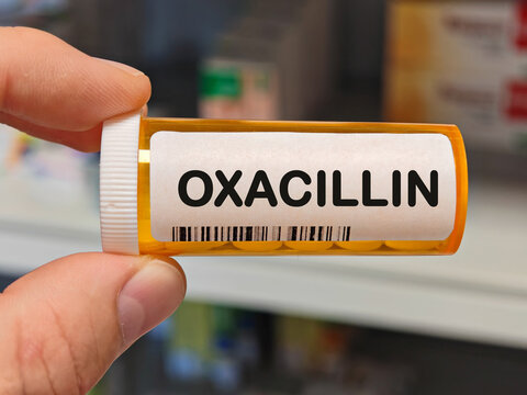 Box of OXACILLIN tablets on a hospital pharmacy table used to treat bacterial infections a penicillin antibiotic.