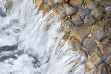 Water flowing over rocks in river stream
