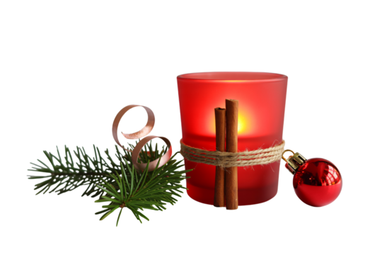 Festive red candle with cinnamon sticks and Christmas ornaments creates a warm, inviting holiday scene for seasonal decor and celebrations