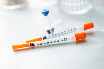 Naklejka premium Close up of Single Use Syringes with Small Glass Vials