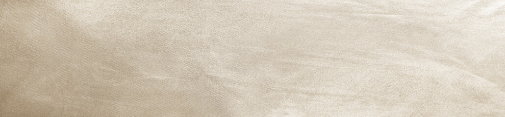 Light soft pale pastel brown golden beige nude white abstract background. Shiny silk fabric. Metallic shine reflection. Empty blank template design. Minimal. Wide banner. Panoramic.