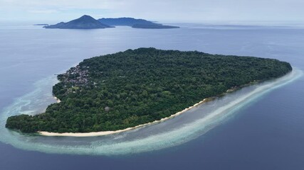 A beautiful coral reef fringes the island of Ai in the remote Banda Islands of Indonesia. This region is home to spectacular marine biodiversity and is a destination for divers and snorkelers.