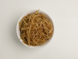 Stir fried glass noodles in white bowl
