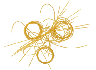 Golden uncooked spaghetti pasta strands tangled and coiled, ready for cooking
