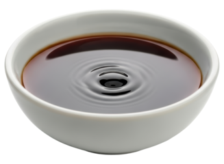 Appetizing soy sauce in a small white bowl with subtle ripples, perfect for asian cuisine.
