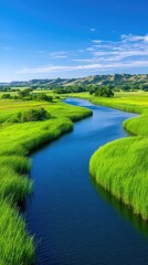 Vibrant Green Marshland With Winding Blue River Under A Clear Blue Sky With Wispy Clouds On A Sunny Day