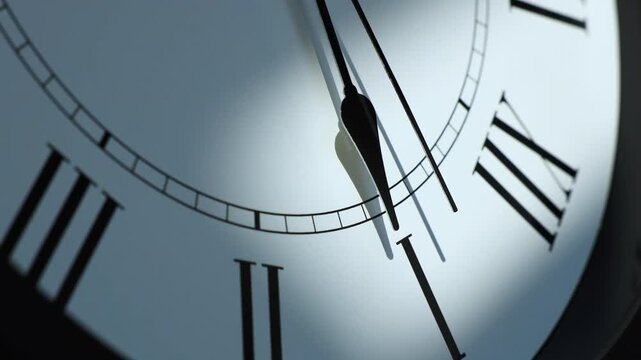 Sun and sky reflecting in the watch during the time passing by. Time lapse on a modern white Clock on white.  Close up to a wall clock, with running time pointer. Wall clock show the running time. 