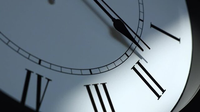 Sun and sky reflecting in the watch during the time passing by. Time lapse on a modern white Clock on white.  Close up to a wall clock, with running time pointer. Wall clock show the running time. 