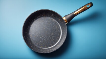 Non-Stick Frying Pan with Ergonomic Handle on Blue Background, Ideal for Cooking and Kitchenware