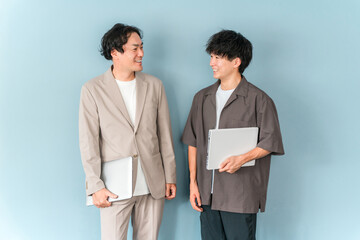 Smiling businessman with a computer (programmer, engineer, system engineer)
