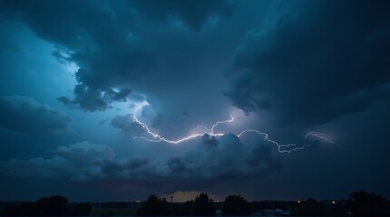 A dramatic lightning strike illuminates a dark, stormy sky filled with ominous clouds, casting a vibrant blue glow over the distant horizon.