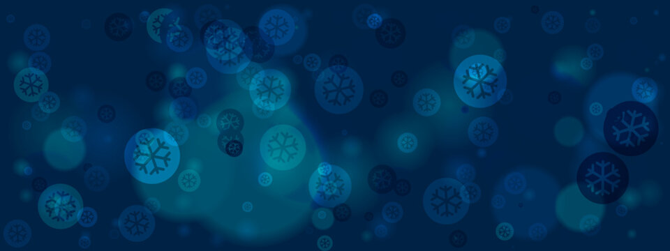 Abstract blue winter background with glowing snowflake bokeh lights and blurred festive elements