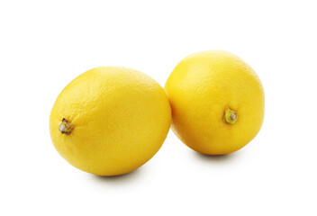 Two whole ripe lemons isolated on white