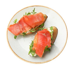 Tasty bruschettas with salmon and arugula isolated on white, top view