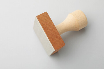 One wooden stamp on white background, closeup