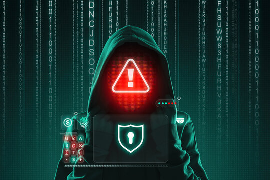 Cyber attack. Anonymous hacker with warning sign instead of face using virtual screen. Programming codes on dark green background