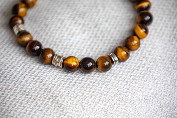 Wonderful men's bracelet made of tiger's eye stone with 925 silver. A semi-precious gemstone from the quartz group, with golden and brown tones and a silky sheen that resembles a tiger's eye.