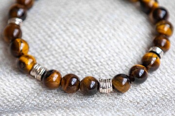 Wonderful men's bracelet made of tiger's eye stone with 925 silver. A semi-precious gemstone from the quartz group, with golden and brown tones and a silky sheen that resembles a tiger's eye.