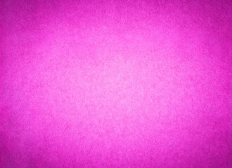 Pink color paper background texture. Sheet of bright fuschia stained arts and crafts cardboard with rough discoloured textured grain surface.