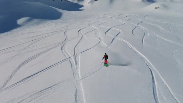 bstract snowboard tracks weaving down mountain slope, elegant S shaped patterns in fresh snow, freeriding visualization