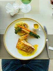 Grilled Salmon Fillet with Vegetables and Lemon Butter Sauce
