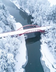 Red bridge spans a cold, snowy river
