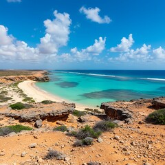 Turquoise Waters Meet Rugged Coastline Under a Vast Blue Sky.