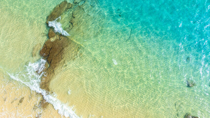 Nature of the ocean and blue sky Summer with sunshine, sandy beaches, clear blue waters sparkling against the blue sky. on an island with good ecology and environment Background for summer vacation