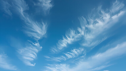 Delicate cirrus clouds in clear blue sky background nature scene tranquil environment