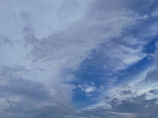 Blue sky with billowing white clouds and atmospheric cloudscape