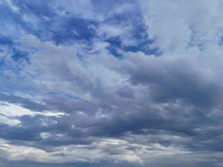 Blue sky with billowing white clouds and atmospheric cloudscape
