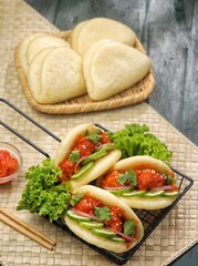Korean Pao.Bao buns with chicken crispy and vegetable. Asian cuisine