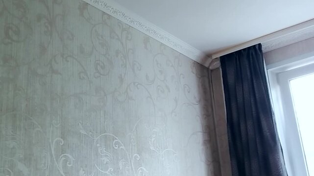 Quiet cozy bedroom daylight through the window dark drapes and molding camera movement Background for slow living blogs and home comfort topics no people