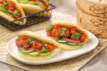 Korean Pao.Bao buns with chicken crispy and vegetable. Asian cuisine