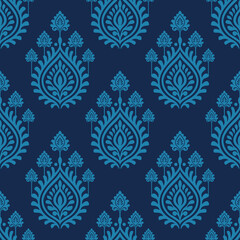 Blue floral damask pattern on dark background with elegant symmetrical leaf motifs creating classic decorative design