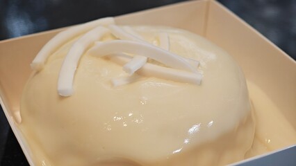 Coconut cake with coconut fresh cream.