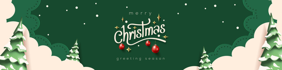 Horizontal green Merry Christmas and Happy New Year greeting card header banner in paper art style with snowy winter landscape snow covered trees for holiday message and festive background
