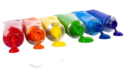 Tubes of colorful paint, arranged by color, oozing out onto a dark background