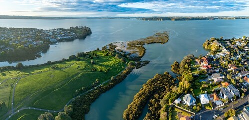 Aerial view of Westmere, Auckland, New Zealand. The photo captures the river's flow through...