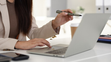 Adult Asian business professional hands work laptop stylus remote learning online office technology