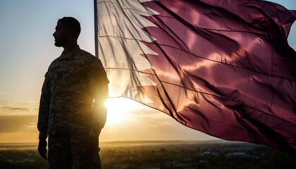 Powerful soldier silhouette stands with Qatar flag at sunset, embodying patriotism and national pride for remembrance day events and independence celebrations