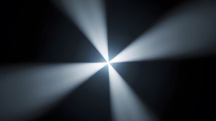Glowing rays of light forming a dramatic starburst effect on a mysterious black background