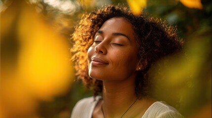 Woman with eyes closed enjoying sunlight, surrounded by golden foliage. Warm glow