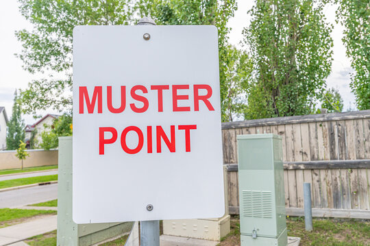 Muster point sign to direct fire emergency evacuation