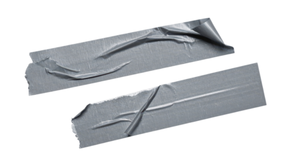 Torn Tape Strips: Two rectangular pieces of gray tape with torn edges lie scattered, showcasing their use and wear, offering a sense of function and practicality.