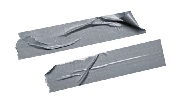 Torn Tape Strips: Two rectangular pieces of gray tape with torn edges lie scattered, showcasing their use and wear, offering a sense of function and practicality.